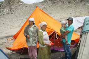 Flash flood victims in India at tent shelters