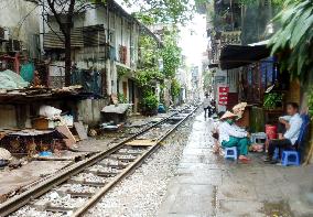 Vietnam railway runs through residential areas