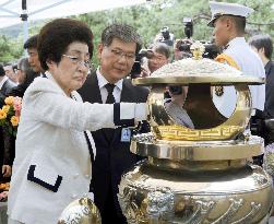 Late S. Korean President Kim's widow on his death anniversary