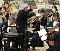 Conductor Ozawa makes brief comeback at concert