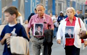 9/11 victims' families head for memorial ceremony