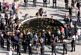 9/11 victims' families offer flowers