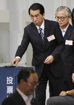 Kan keeps power beating Ozawa in election