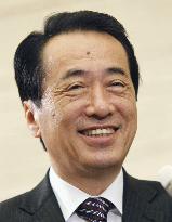 PM Kan speaks to reporters