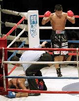 Uchiyama defends super featherweight title