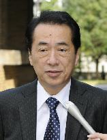 PM Kan speaks to reporters in Tokyo