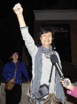 Woman celebrates as Liu awarded Nobel Peace Prize