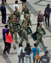 Chinese police patrol near Ito-Yokado in China's Chengdu
