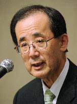 BOJ sees monetary easing generates positives