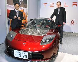 Tesla presents Toyota president with EV
