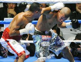 Kameda 1st Japanese boxer to win 3 world titles