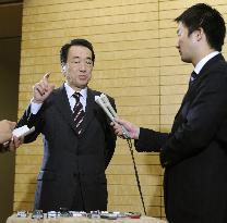 Kan speaks to reporters