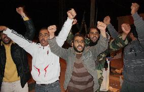 Libyan protesters celebrate