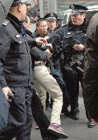 Chinese police disperse street protesters