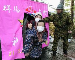 Evacuees use bathing facility