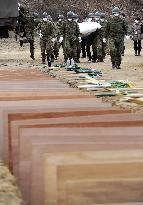 Burial of quake, tsunami victims
