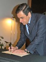 French PM Fillon signs condolence book for quake victims