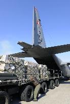 U.S. forces transport water to quake-hit areas