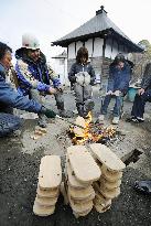 Burning monks' footware at disaster area