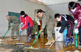 U.S. military personnel clean up tsunami-hit school