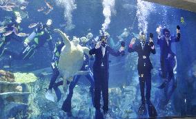 Aquarium's initiation ceremony in water tank