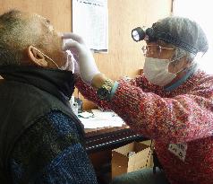 Dentist at evacuation center in quake-hit Onagawa