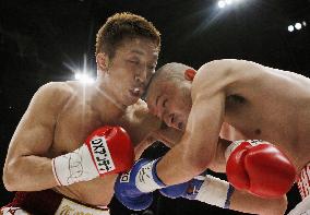 Ao gets KO to defend WBC super featherweight crown