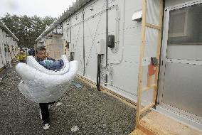 Tsunami survivors begin moving into temporary housing