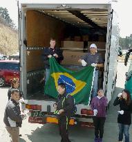 Brazilians in Japan deliver aid materials