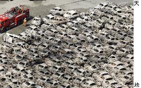 Cars damaged by tsunami in Hitachi