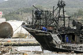 Burned ship after tsunami
