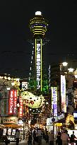 Osaka landmark Tsutenkaku resumes illumination