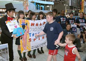 Japan quake orphans appeal for aid in N.Y.