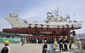 Stranded ship carried to port