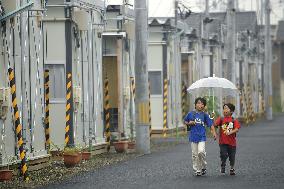 Children go to school from temporary housing