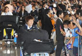 'Nadeshiko Japan' return home after victory
