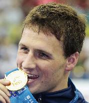 Lochte strikes gold in 200 individual medley with world record