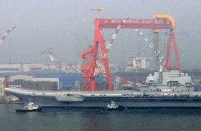 China's 1st aircraft carrier returns to port