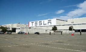 Tesla to make EV at new plant