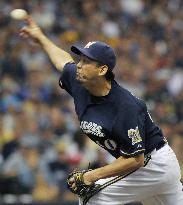 Brewers' Saito earns 1st playoff win