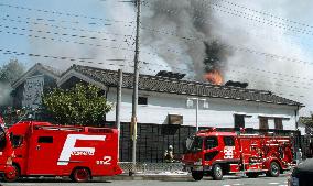 Fire burns old sake brewery