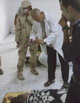 Ex-Libyan leader Gaddafi's body
