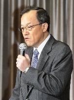 Olympus president Takayama at press conference