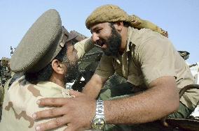Libyan NTC soldiers celebrate fall of Sirte