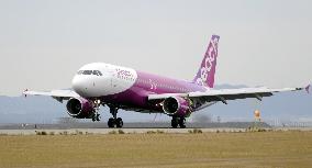 1st airplane of Peach Aviation arrives at Kansai airport