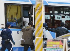 Man holds 2 hostage in bus