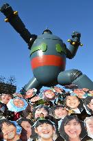 Umbrellas with smiling faces of children