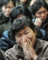 Woman in Pyongyang reacts to Kim's death