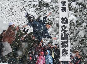 'Groom throwing' festival in snowy area