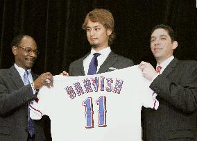 Darvish holds Rangers uniform